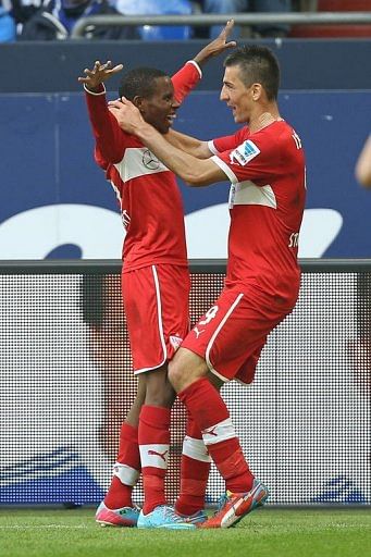 Stuttgart's Vedad Ibisevic and Ibrahima Traore (L) celebrate scoring against Schalke in Gelsenkirchen, May 11, 2013